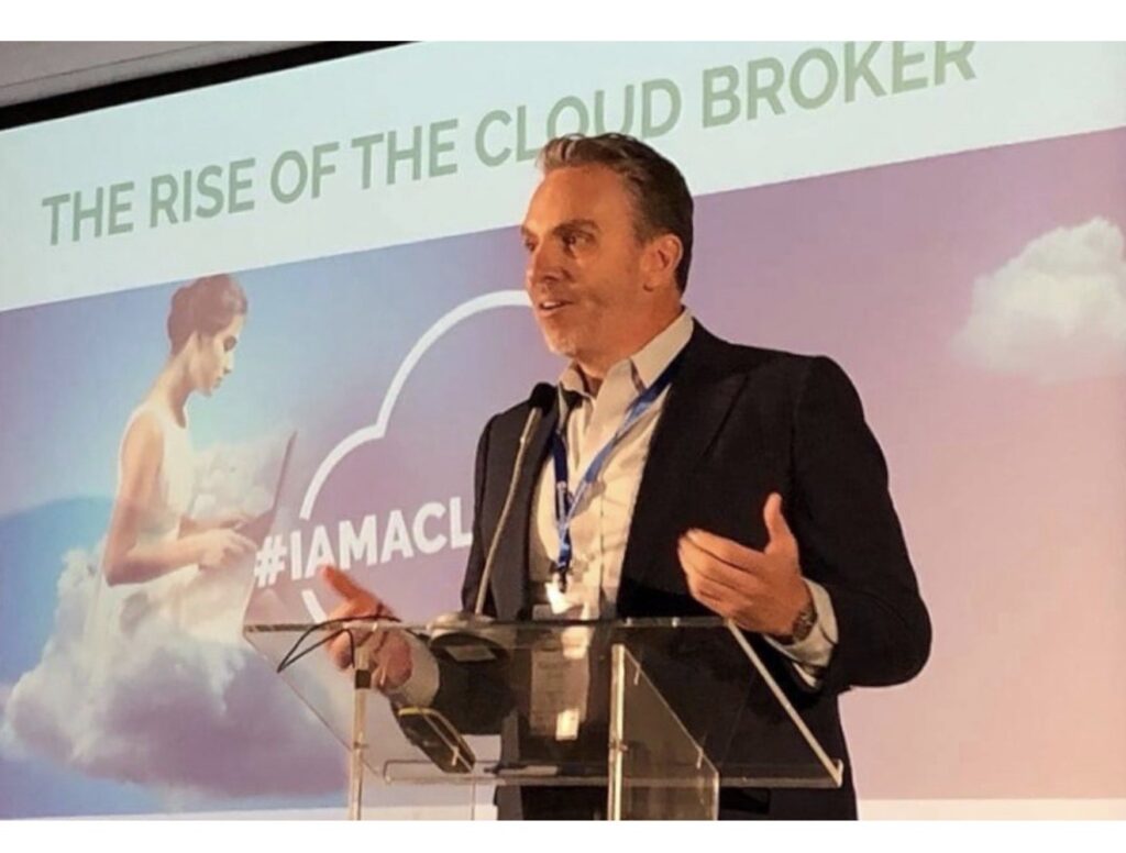 George Leith speaking on stage about The Rise of the Cloud Broker